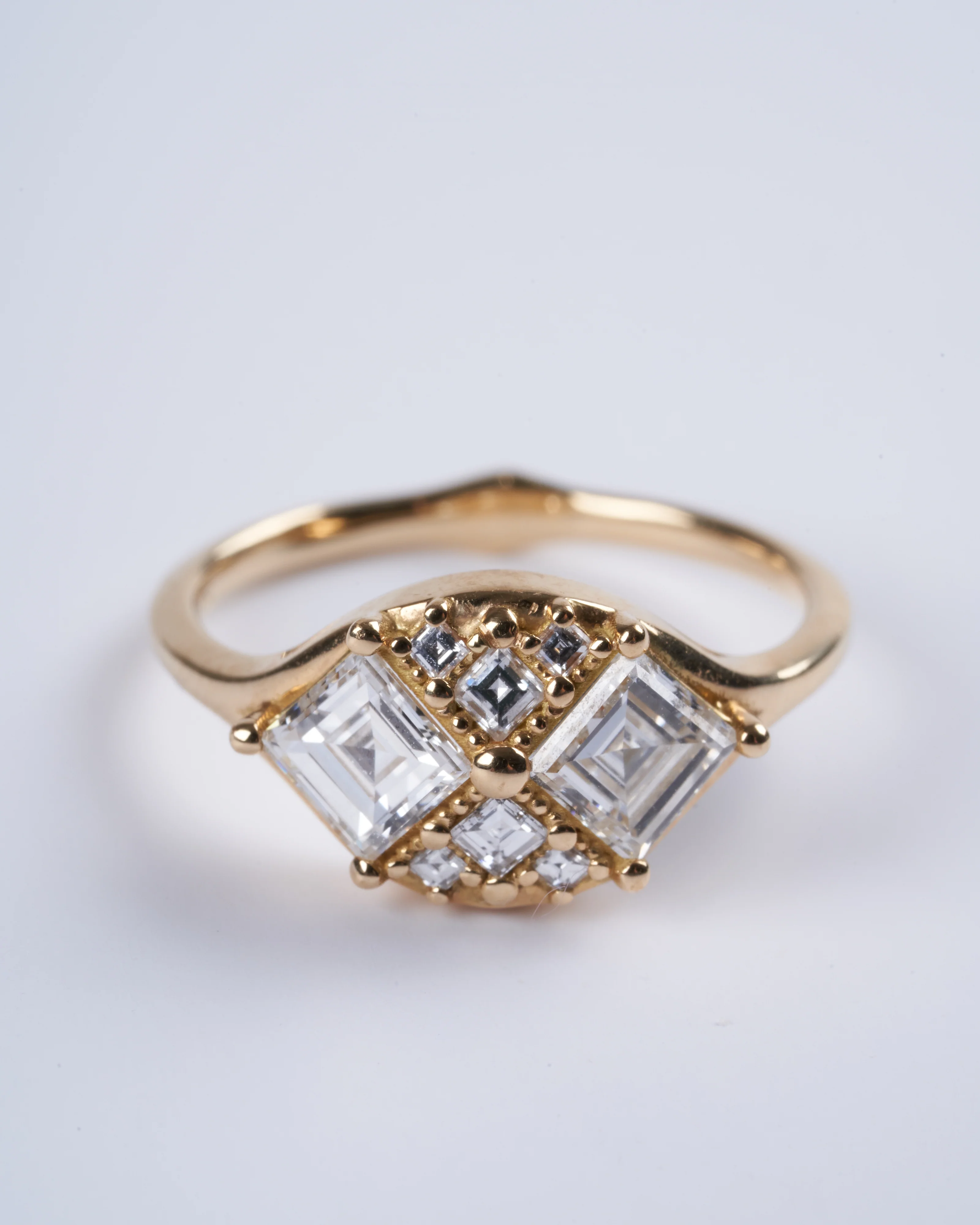 step cut engagement ring with eight square - gold