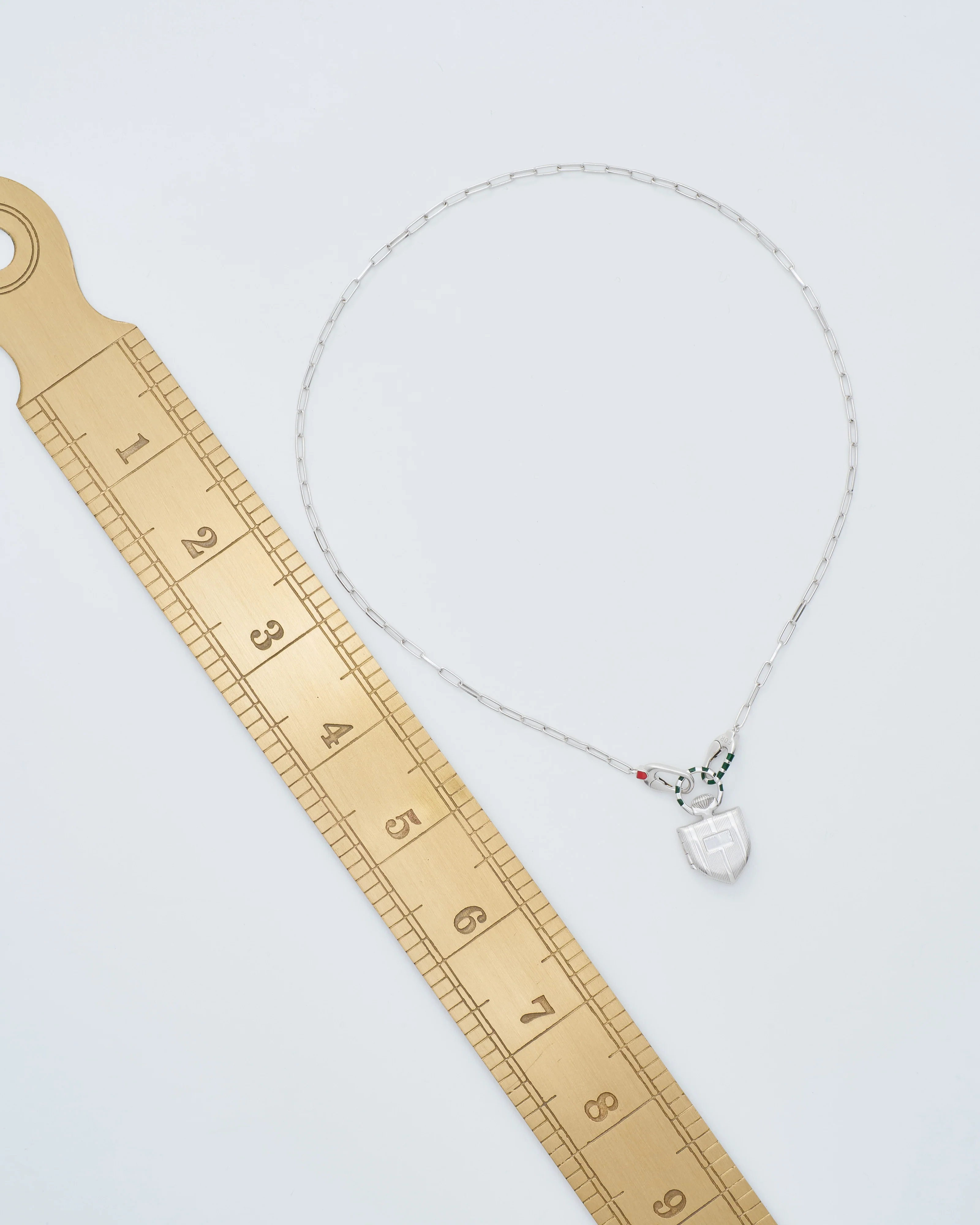 the curiouser vault (ss) w/ silver paperclip chain - Image 9