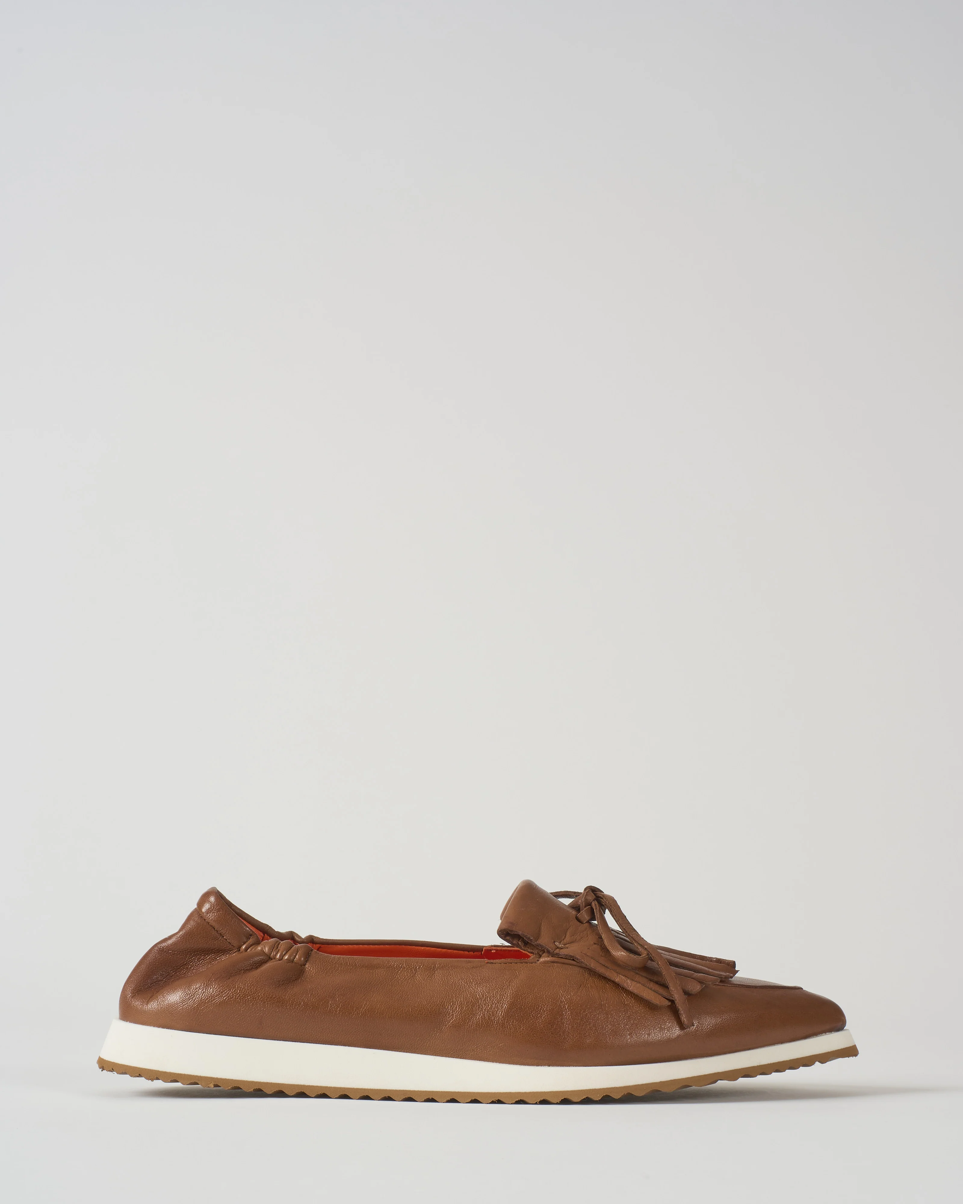 pointed toe kiltie tassel flat with sport bottom