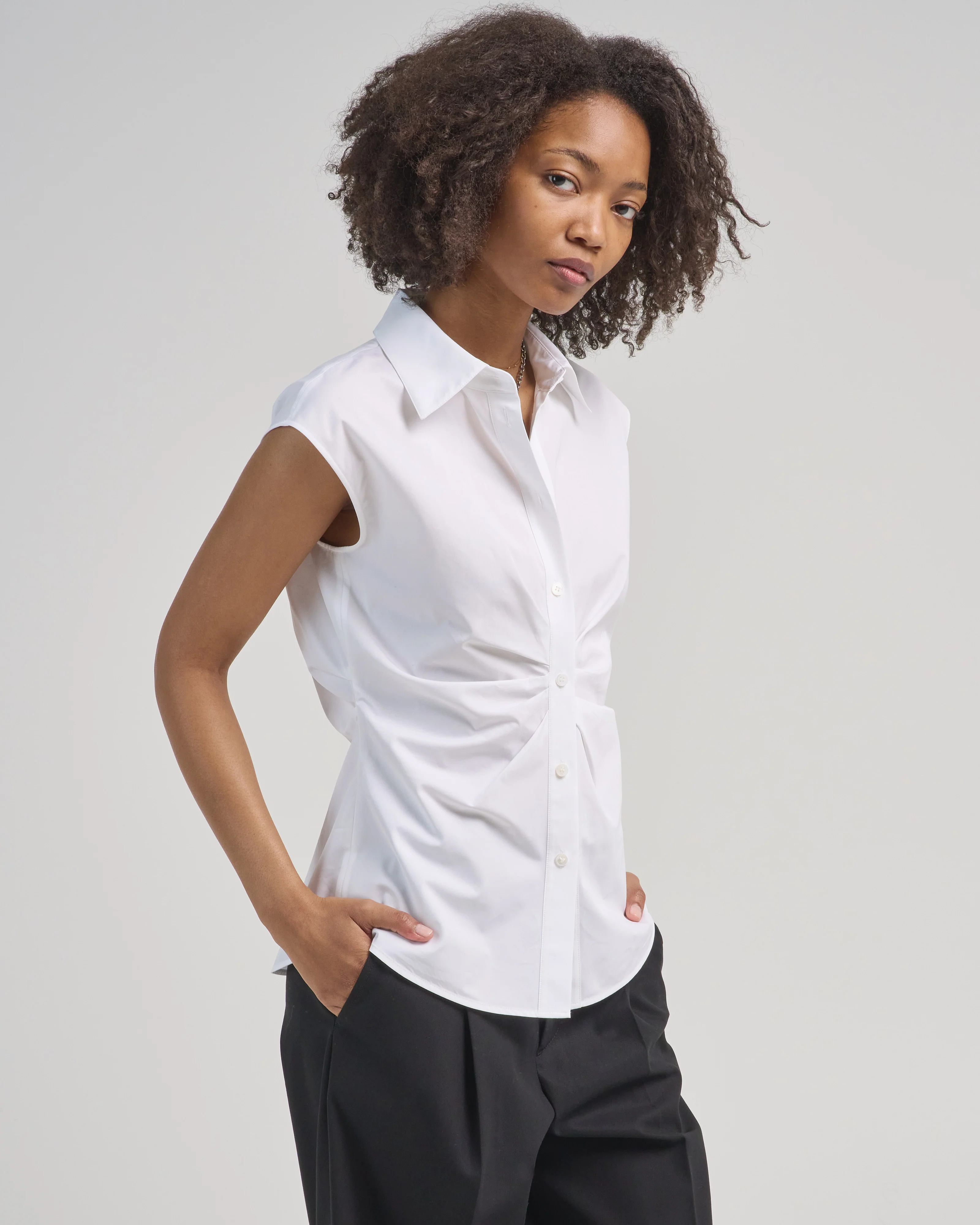 sleeveless button front shirt with irregular pleats - Image 4