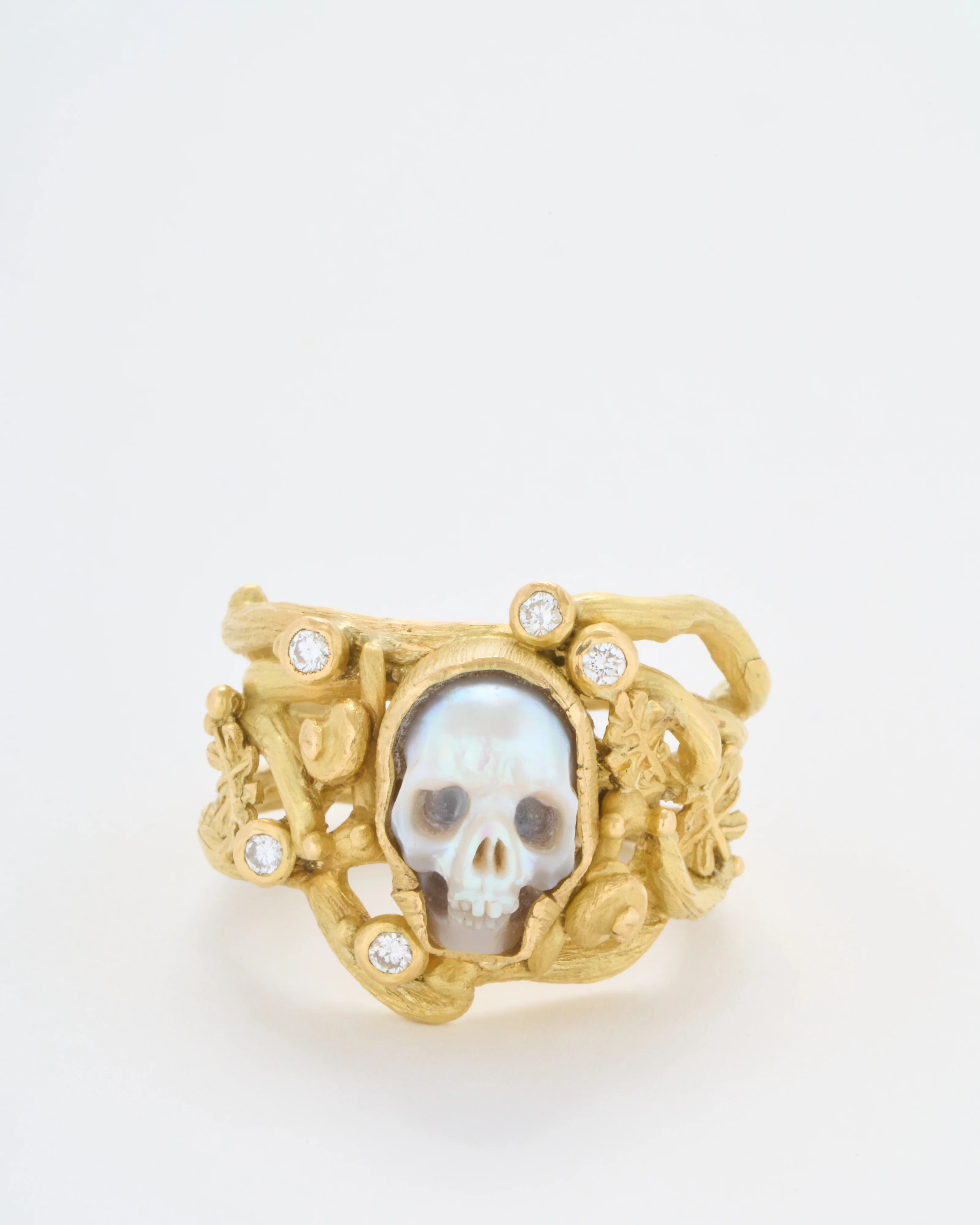 carved pearl fairy skull ring