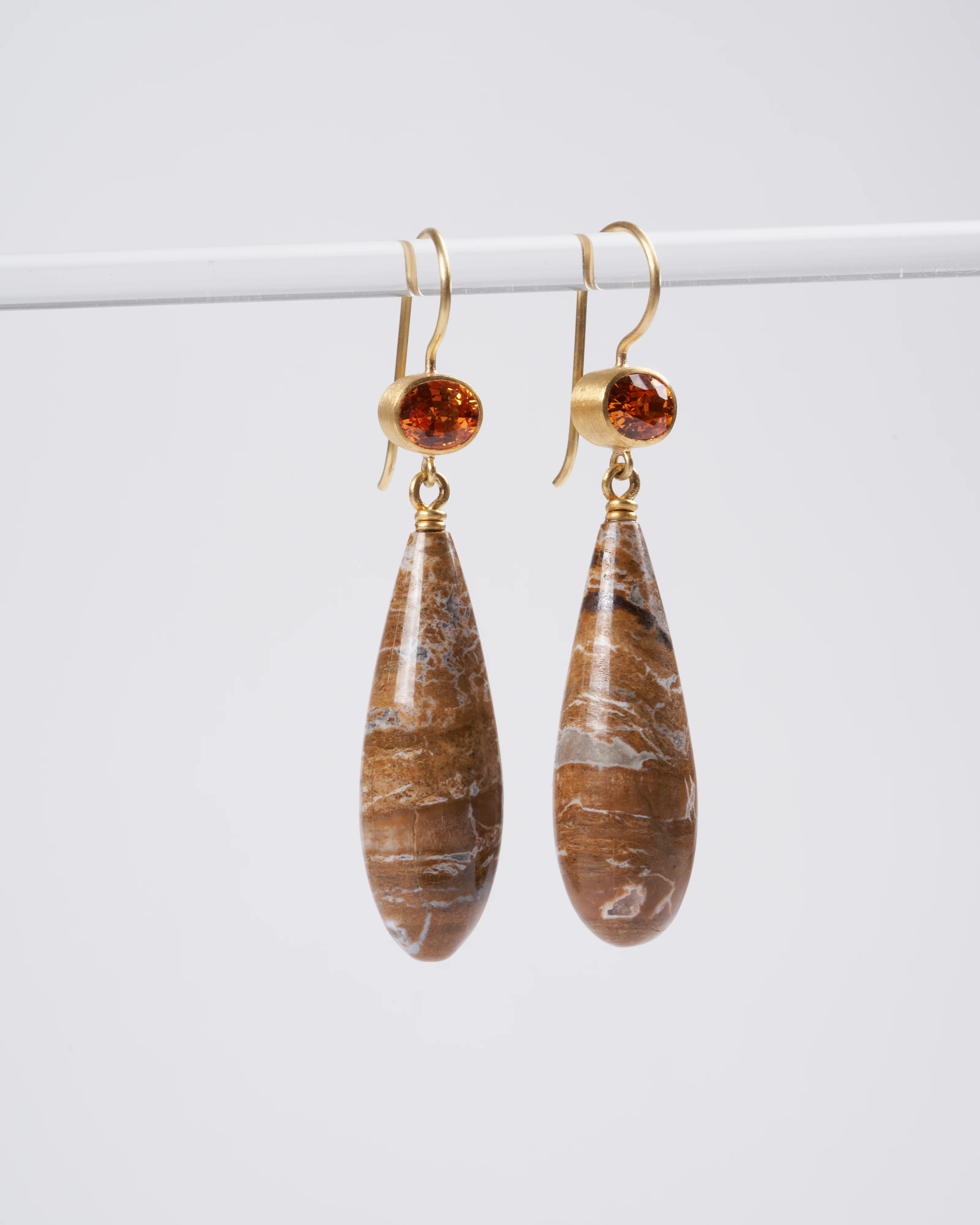 ofk apple and ear wire oval orange sapphires with fosilicized wood 22/18k yg - brown
