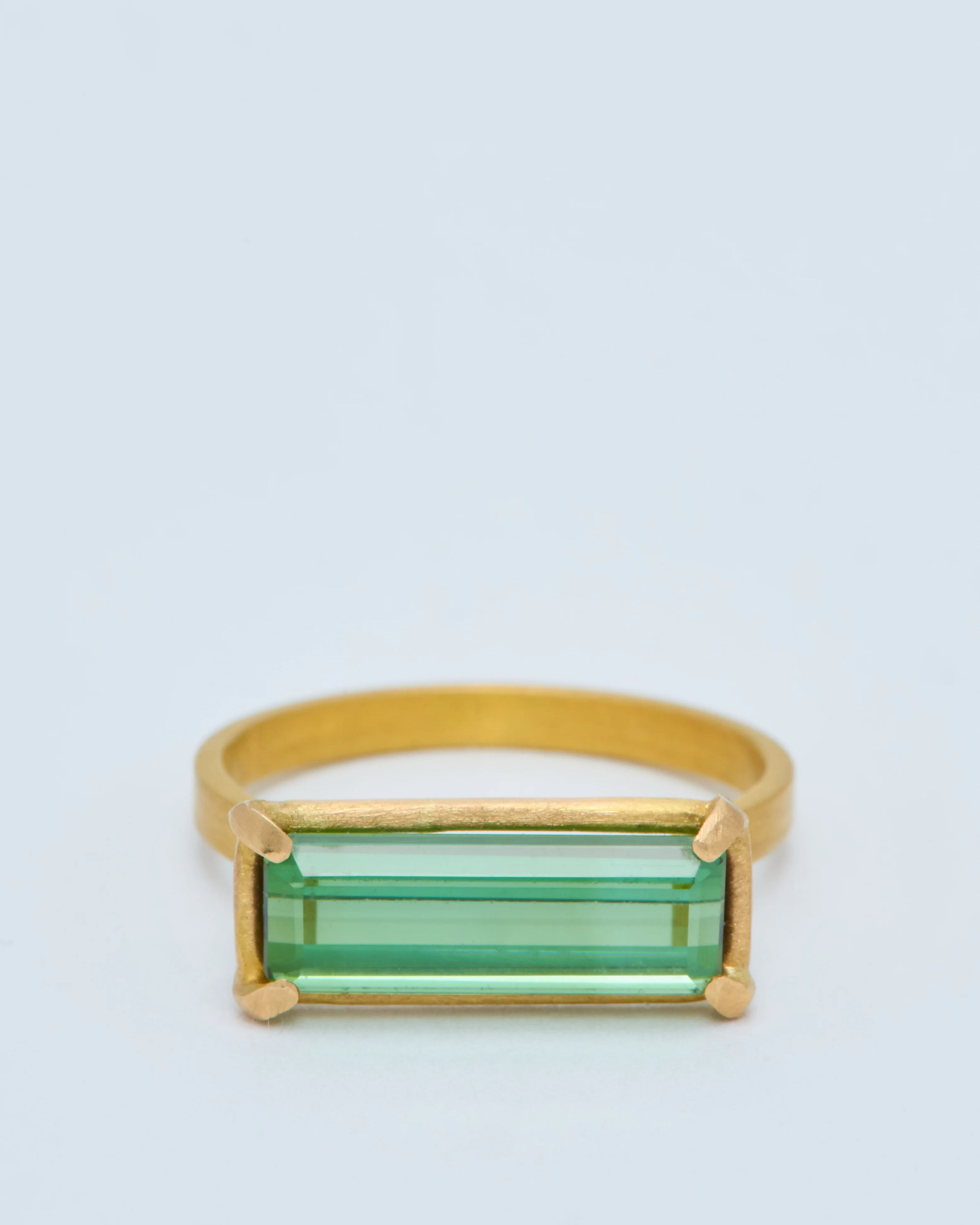 green tourmaline east west ring