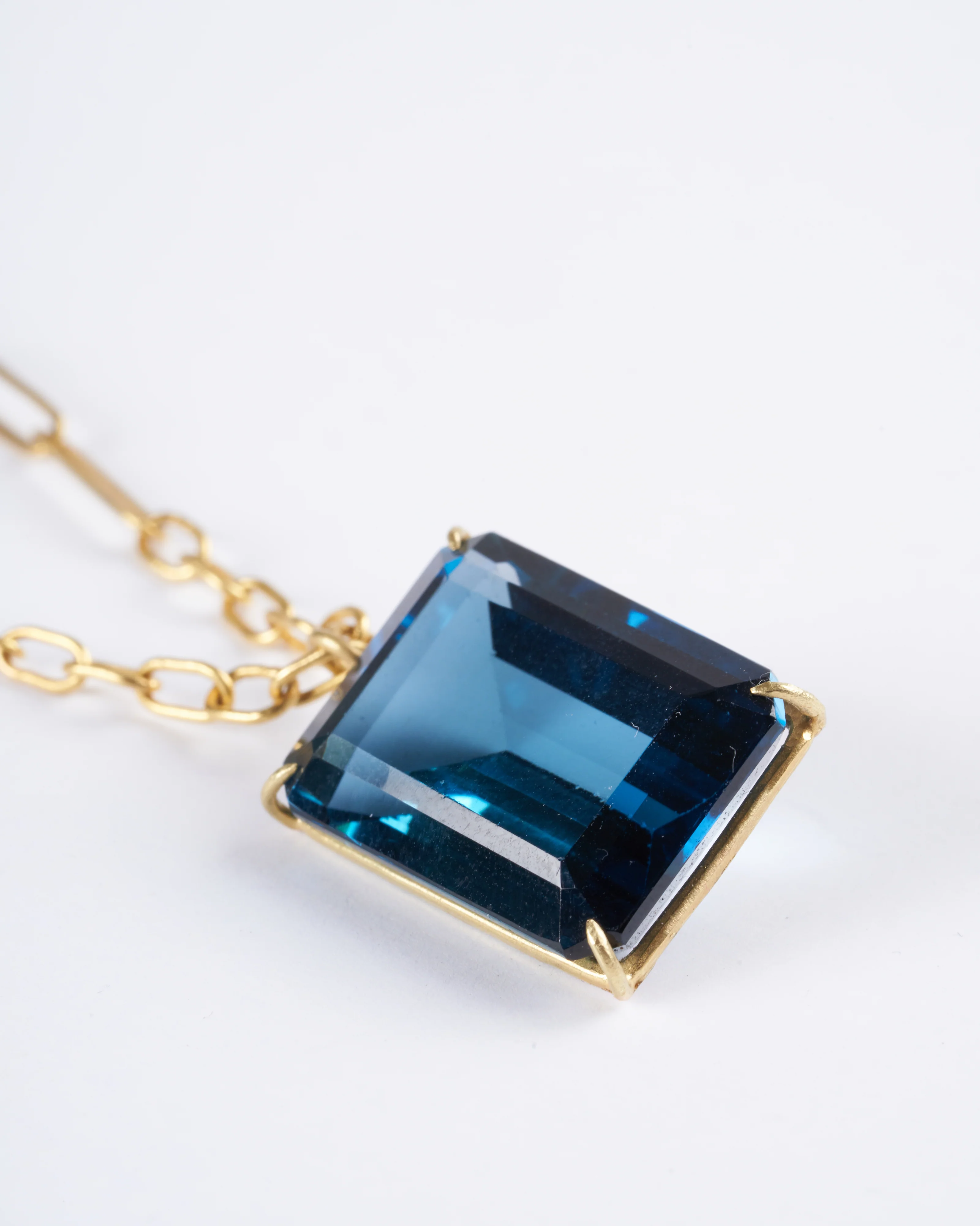emerald cut london blue topaz set in yellow gold - Image 4