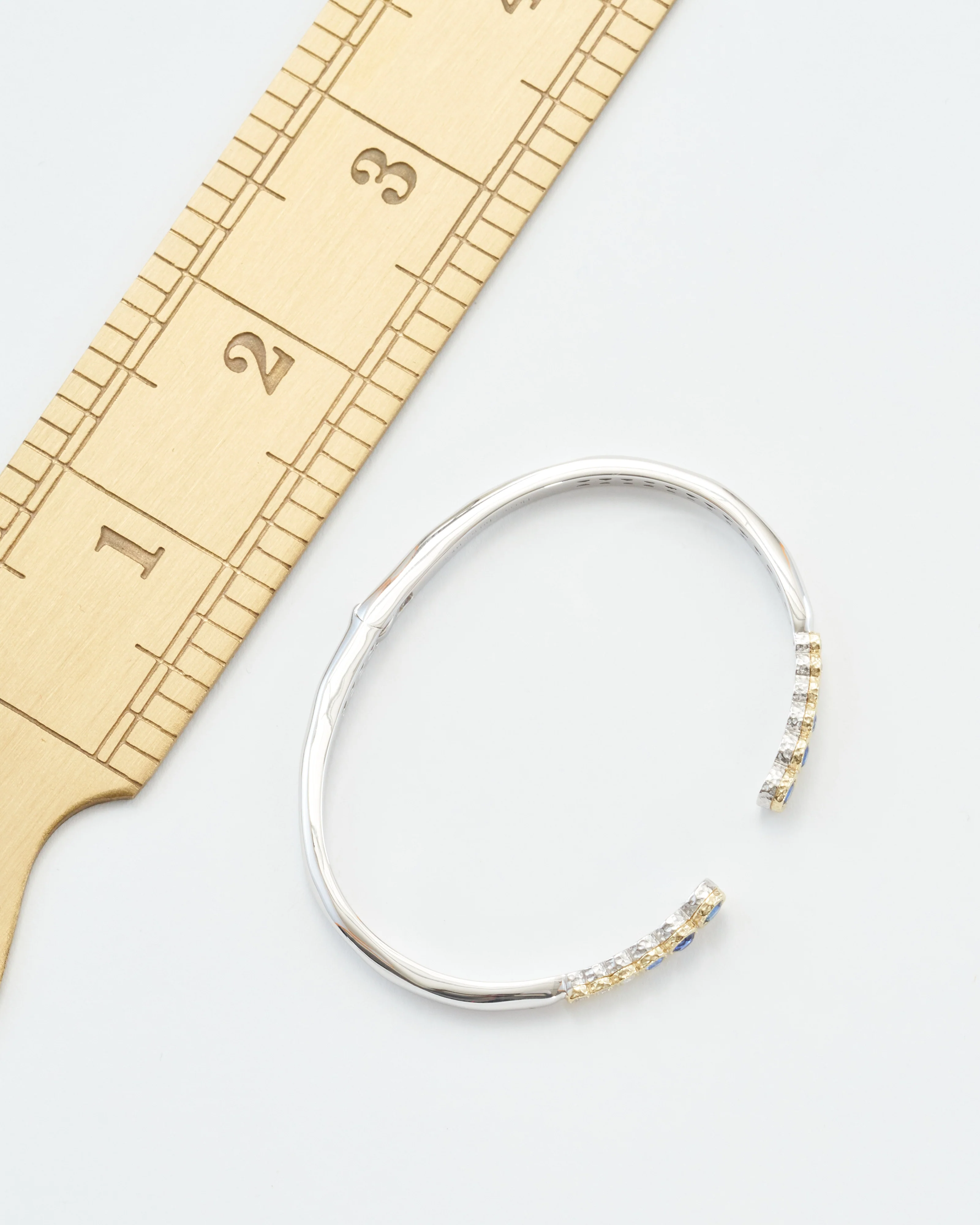 classic two-toned open bezel set sapphire bangle - Image 8